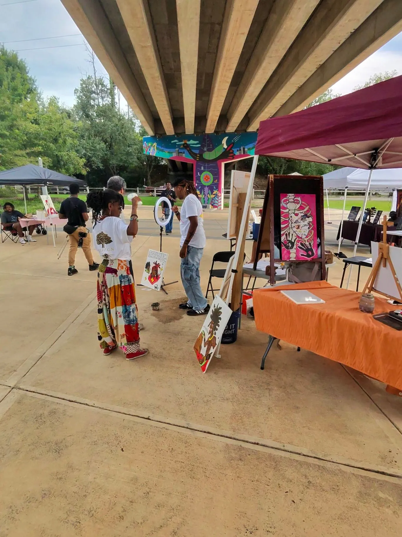 Community art display under a covered gathering space